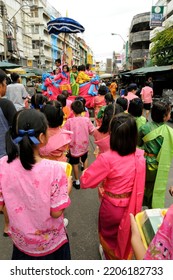 BANGKOK, THAILAND - August 1, 2012. Asahna Bucha Religious School Procession (commemorates Buddha's First Sermon On The Four Noble Truths). Children Carry Gifts For Buddhist Monks Who Begin Fasting.