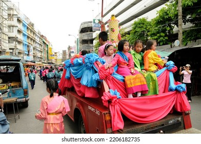 BANGKOK, THAILAND - August 1, 2012. Asahna Bucha Religious School Procession (commemorates Buddha's First Sermon On The Four Noble Truths). Children Carry Gifts For Buddhist Monks Who Begin Fasting.