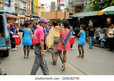 BANGKOK, THAILAND - August 1, 2012. Asahna Bucha Religious School Procession (commemorates Buddha's First Sermon On The Four Noble Truths). Children Carry Gifts For Buddhist Monks Who Begin Fasting.