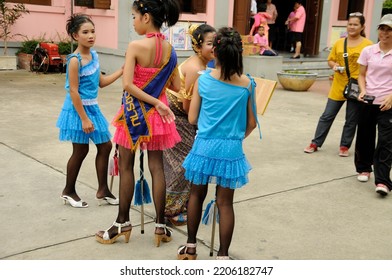 BANGKOK, THAILAND - August 1, 2012. Asahna Bucha Religious School Procession (commemorates Buddha's First Sermon On The Four Noble Truths). Children Carry Gifts For Buddhist Monks Who Begin Fasting.