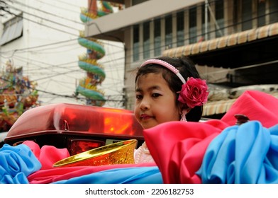 BANGKOK, THAILAND - August 1, 2012. Asahna Bucha Religious School Procession (commemorates Buddha's First Sermon On The Four Noble Truths). Children Carry Gifts For Buddhist Monks Who Begin Fasting.