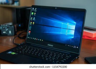 Bangkok, Thailand - August 13, 2018 : Laptop Computer Showing Its Screen With Microsoft Windows Logo On Desktop.