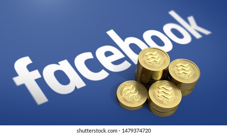 BANGKOK, THAILAND - AUGUST 15th, 2019: Gold Libra Coin On Stack Of Coins With The Facebook Logo Background.