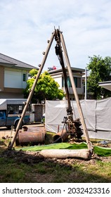 BANGKOK, THAILAND - AUGUST 19, 2021 : Tripod And Drilling Bucket Are Prepared For Dry Process Bored Pile At The Site Of New House Construction