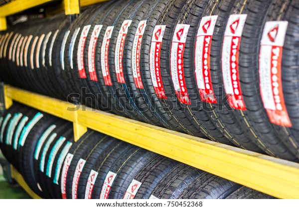 Bangkok Thailand:- August 20: 2017 - Tire\
Firestone shop Tire replacement service center In the checking\
center change old tires into new\
tires.