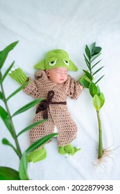 Bangkok, Thailand - August 2021: Cute Newborn Baby In A Grogu Costume. Nature Concept.