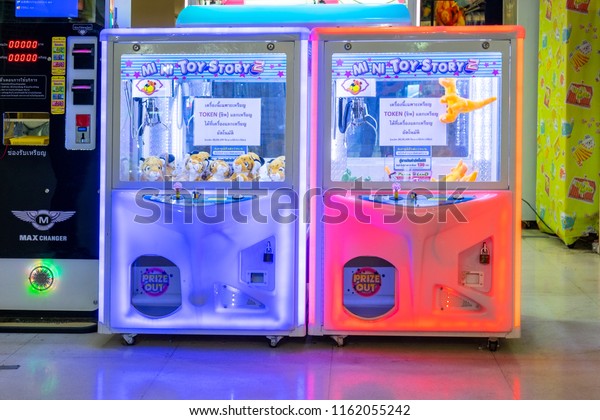 BANGKOK, THAILAND - August 22: Century Movie Plaza\
on August 22,2018 in Bangkok, Thailand. Machine of Claw Game or\
Cabinet to Catch the Dolls placed waiting tourist people insert\
coin for play game.