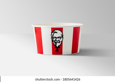 BANGKOK, THAILAND - August 24, 2020:  Illustrative editorial image of KFC soft drink paper cup on red striped background. KFC is an American fast food restaurant chain known as Kentucky Fried Chicken.