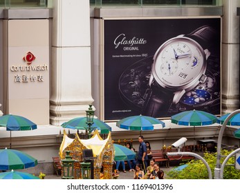 BANGKOK, THAILAND - AUGUST 25, 2018: Wide Detail Of An Advertisement For Glashutte Orignal Watches At Erawan Shrine. Travel And Tourism.