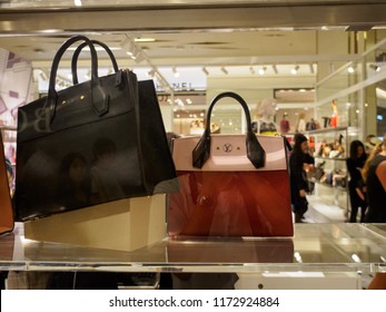 BANGKOK, THAILAND - AUGUST 25, 2018: Close-up Of Multiple Leather Handbags On The Shelves Of A Louis Vuitton Boutique. French Luxury Designer Fashion Industry.