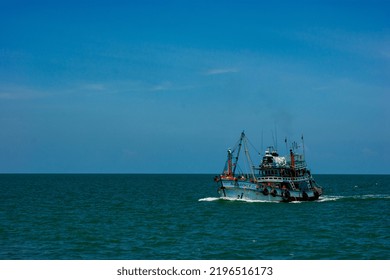 BANGKOK, THAILAND - AUGUST 25, 2022: Fish Boat Vessel Fishing In A Rough Sea.