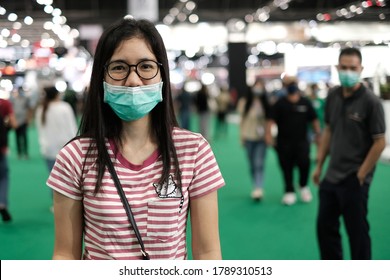 Bangkok, Thailand - August 3, 2020 : Beautiful Asian Women At A Trade Show. She Is Wearing A Mask.