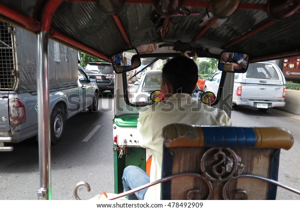 BANGKOK, THAILAND - AUGUST 31, 2016\
: Three wheels Tuk Tuk taxi with driver in Bangkok,\
Thailand