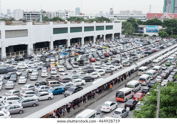 BANGKOK, Thailand - AUGUST 5: Cars were parked\
at free of charge parking lot at Mo Chit Station on August 5, 2016.\
This parking lot for BTS skytrain and MRT subway transit to\
downtown of Bangkok.