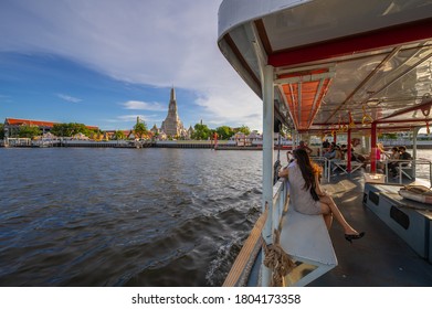 BANGKOK, THAILAND - August 9, 2020 : Picture of Wat Arun taken from a boat where tourists are traveling to see the beauty of this place.