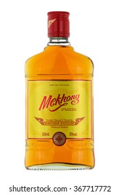 BANGKOK, THAILAND - CIRCA DECEMBER 2015 : A 350ml. bottle of Mekhong whisky isolated on white in Bangkok, Thailand on December 21, 2015. Mekhong is a Thai rum distilled from 95% sugar cane and 5% rice. 