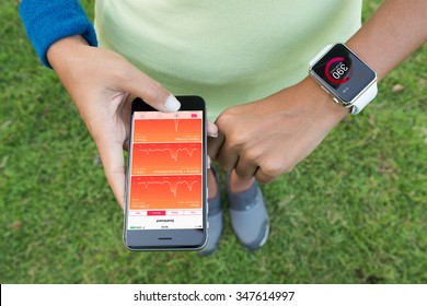 Bangkok, Thailand - Dec 5, 2015 : Women Using Iphone 6s And Apple Watch Check Health Application