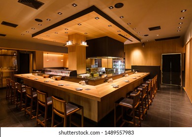 BANGKOK, THAILAND. DEC 8, 2016:  Yakitori Japanese Grilled Skewer Restaurant With Counter Bar Around The Grill Kitchen Area. Mostly Decorated With Oak Wood Texture.