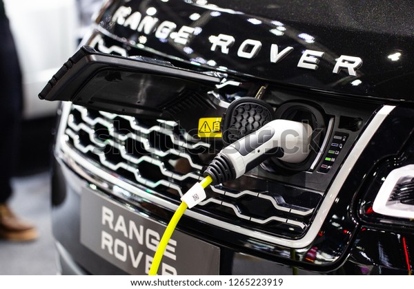 Bangkok\
,Thailand - December 07 , 2018 : Adapter for charging of electric\
car design by Range Rover show in yearly exhibition \
