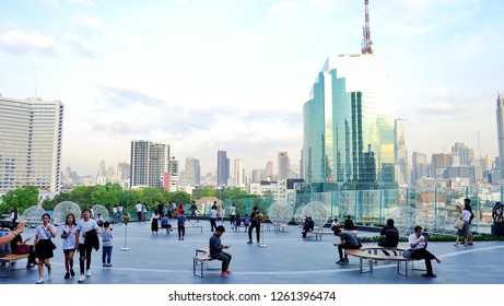BANGKOK, THAILAND - DECEMBER 14,2018 : A beautiful view point with many people and high buildings around the area,in front of ICONSIAM mega store, a new landmark in downtown of Bangkok, Thailand 