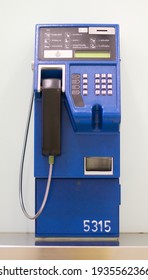 Bangkok, Thailand - December 26, 2020 : Coin-operated Public Telephone Booth. Blue Vintage Pay Phone Indoor. Retro Concept.