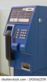 Bangkok, Thailand - December 26, 2020 : Coin-operated Public Telephone Booth. Blue Vintage Pay Phone Indoor. Retro Concept.