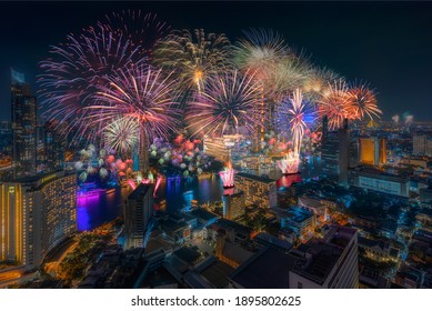 Bangkok, Thailand. December 31, 2020.
Beautiful Firework With Multi Colors At Chao Phraya River With View Of Bangkok Cityscape For Count Down New Year Festival.