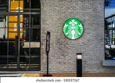 Bangkok, THAILAND - December 4, 2016: Starbucks coffee shop sign on brick wall. Starbucks is the largest coffeehouse in the world.