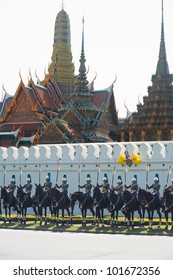 Bangkok, Thailand - December 5, 2010: Row of lined up Royal Mounted Guard waiting for the King in front of the Grand Palace wall on the King's birthday parade