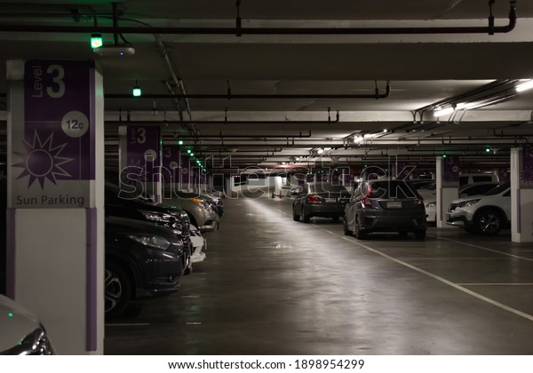 Bangkok, Thailand -\
December 5, 2020 : Smart parking guidance in department store with\
light overhead, car\
lot.