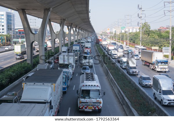 BANGKOK, THAILAND -December 6,2019 : Transport\
Environmental pollution, Traffic jam in rush hour in BKK on travel\
or business work. City traffic or traffic jams with stream of cars\
in Bangkok Thailand