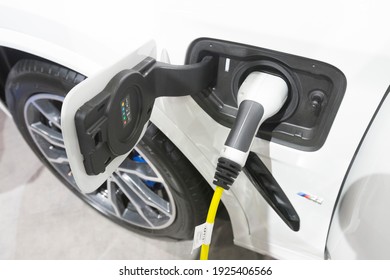 Bangkok, Thailand - December 8,2020 : Close up view of BMW emissions vehicle electric charging socket plug in to recharge in Bangkok, Thailand on December 8,2020.
