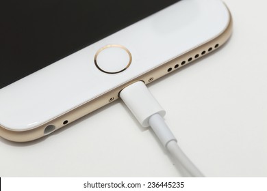 BANGKOK, THAILAND -DECEMBER 9, 2014: close up image of the new apple iphone6 with the charging cable on December 9, 2014 in Bangkok Thailand.