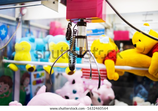 BANGKOK, THAILAND - FEB 1 :\
Arcade claw machine game. Machine claw grabber game randomly\
selecting dolls. at Central Rama II on February 1, 2020 in Bangkok,\
Thailand.