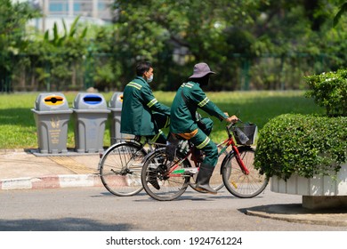 Bangkok, Thailand - FEB 24, 2021: The gardener was riding a bicycle to buy food at noon.