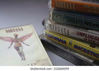 Bangkok, Thailand - February ,09 2022 : 90's Cassette Tapes Of Nirvana Albums Incesticide, Nevermind, Bleach, From The Muddy Banks Of The Wishkah, Unplugged In New York On A Gray Floor.