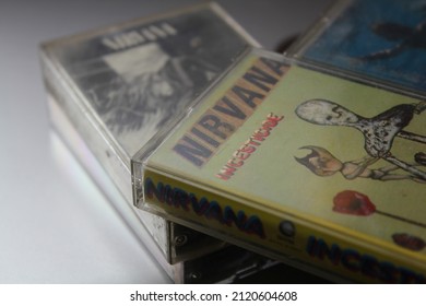 Bangkok, Thailand - February ,09 2022 : 90's Cassette Tapes Of Nirvana Albums Incesticide, Nevermind, Bleach, From The Muddy Banks Of The Wishkah, Unplugged In New York On A Gray Floor.