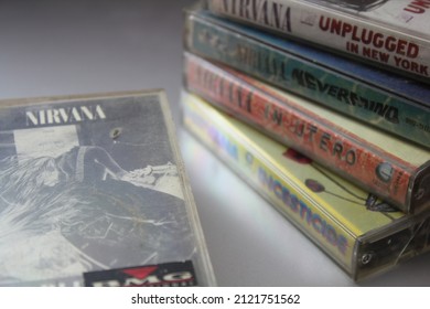 Bangkok, Thailand - February ,09 2022 : 90's Cassette Tapes Of Nirvana Albums Incesticide, Nevermind, Bleach, From The Muddy Banks Of The Wishkah, Unplugged In New York On A Gray Floor.