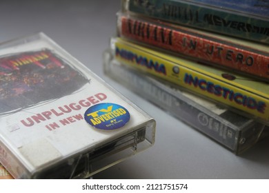 Bangkok, Thailand - February ,09 2022 : 90's Cassette Tapes Of Nirvana Albums Incesticide, Nevermind, Bleach, From The Muddy Banks Of The Wishkah, Unplugged In New York On A Gray Floor.