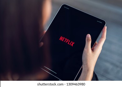 Bangkok, Thailand - February 11, 2019 : Women Use Netflix App On Ipad Pro Screen. Netflix Is An International Leading Subscription Service For Watching TV Episodes And Movies.