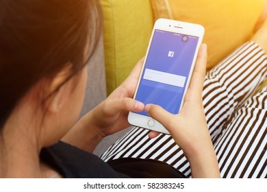 Bangkok, Thailand - February 19, 2017: Girl Holding Iphone 7 Plus With Mobile Application For Facebook On The Screen