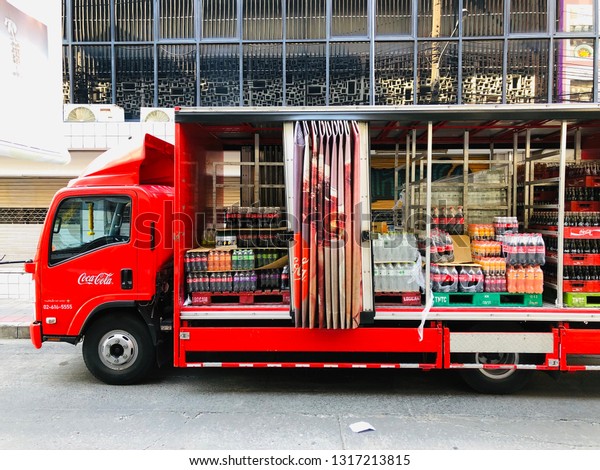 BANGKOK,\
THAILAND. FEBRUARY 19, 2019: the container truck of Coca Cola drink\
supplies the goods to every corner of\
Bangkok