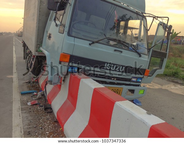 \
Bangkok, Thailand February 2 2014 Truck\
crashed the road\
barrier.