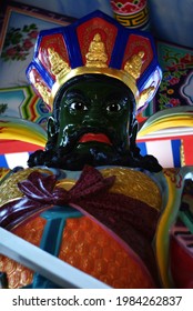 BANGKOK, THAILAND – FEBRUARY 25, 2012: A green Chinese god statue standing at shrine in Wat Krathum Suea Pla Temple in Bangkok province.
