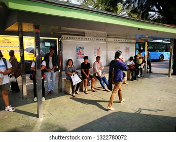 BANGKOK, THAILAND - FEBRUARY 25, 2019: People Man And Woman Wait For Bus In The Afternoon Very Hot.