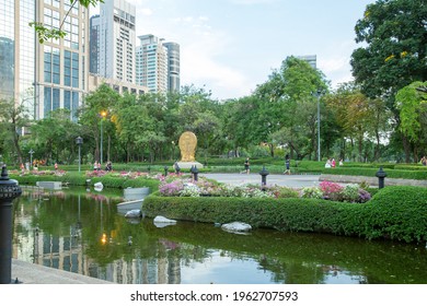 Bangkok, THAILAND - February 25, 2021: People are walk and jogging in the Park on the track in the evening at Benjasiri Park garden, One of the public park for travel around Sukhumvit road in Bangkok.
