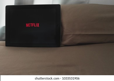 Bangkok, Thailand - February 26, 2018: Netflix And Chill, App Open On IPad Resting On A Brown Pillow