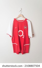 Bangkok, Thailand - Jan 18, 2022 : Arsenal Retro Shirt Home Jersey Season 2002-2004 Hanging On Wall