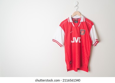 Bangkok, Thailand - Jan 18, 2022 : Arsenal retro shirt home jersey season 1996-1998 hanging on wall