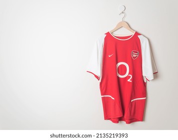 Bangkok, Thailand - Jan 18, 2022 : Arsenal Retro Shirt Home Jersey Season 2002-2004 Hanging On Wall